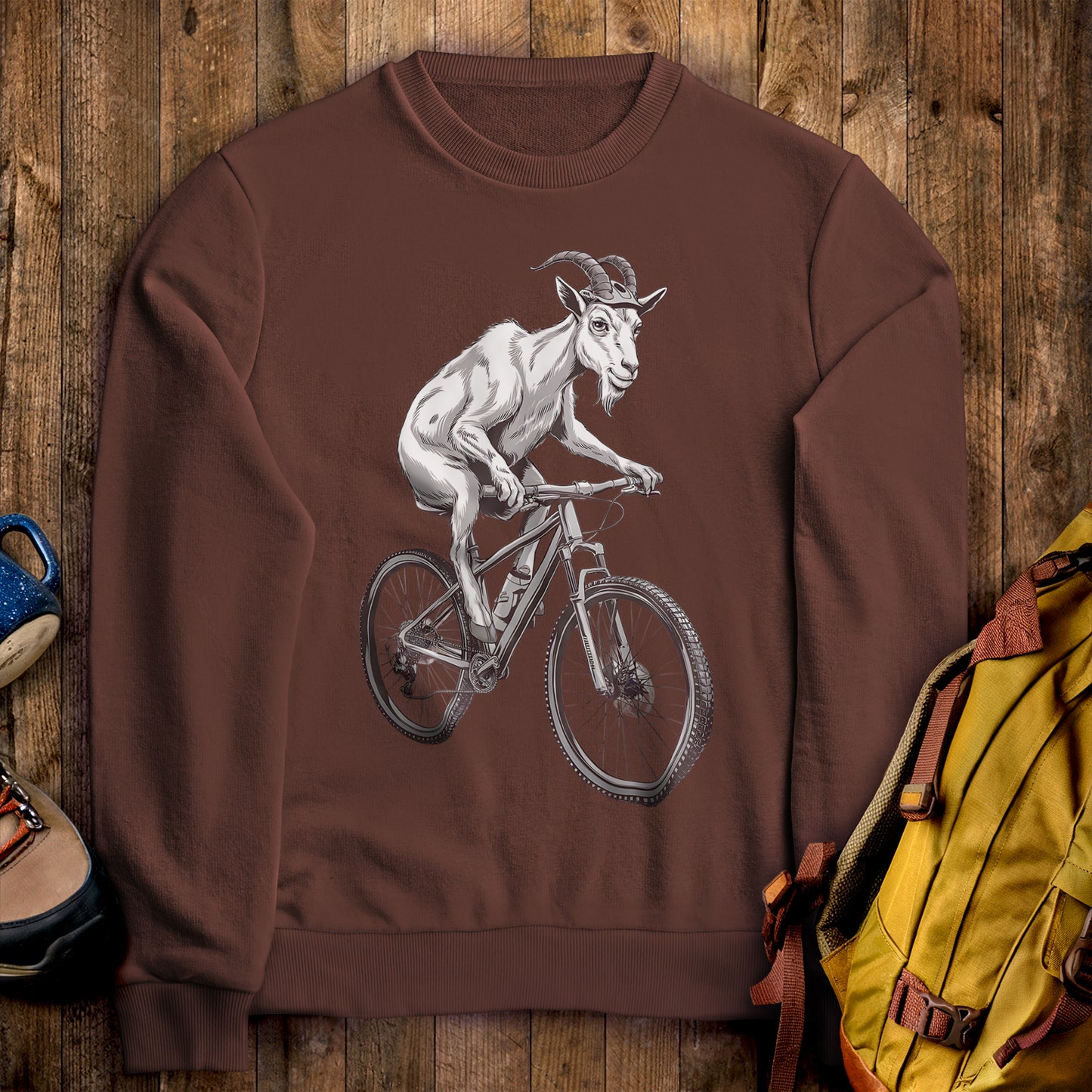 Mountain Goat on a Bike Crewneck Sweatshirt Cocoa Adventure and Outdoors Themed Sweatshirt