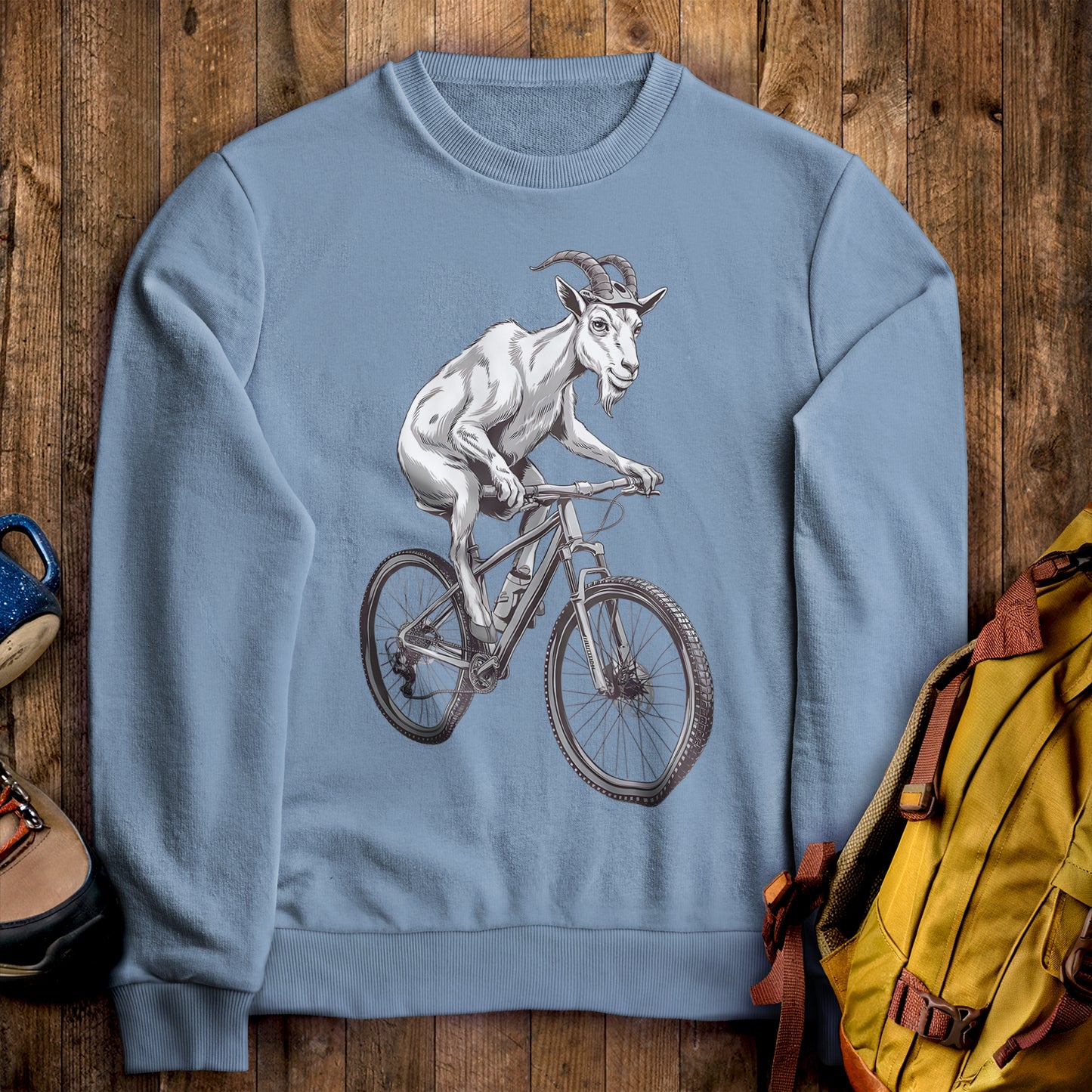 Mountain Goat on a Bike Crewneck Sweatshirt Stone Blue Adventure and Outdoors Themed Sweatshirt